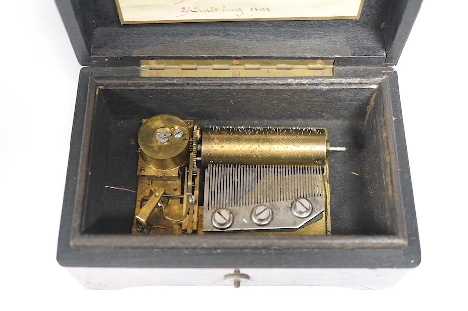 A miniature longcase clock and a miniature yew cylinder musical box, largest 42cm high. Condition - box poor, clock good